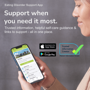 A photo of a young woman looking at an app on a phone screen. Text reads: Eating disorder support app. Support when you need it most. Trusted information, helpful self care guidance and links to support all in one place.